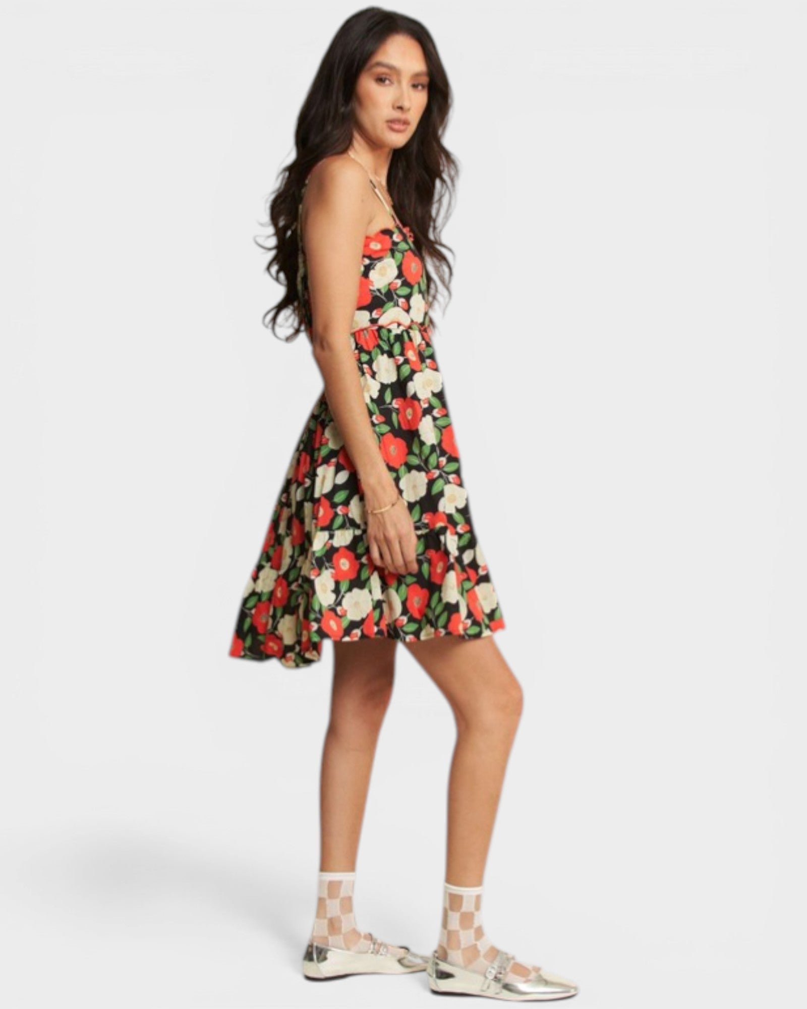 Woman wearing a floral dress on a white background