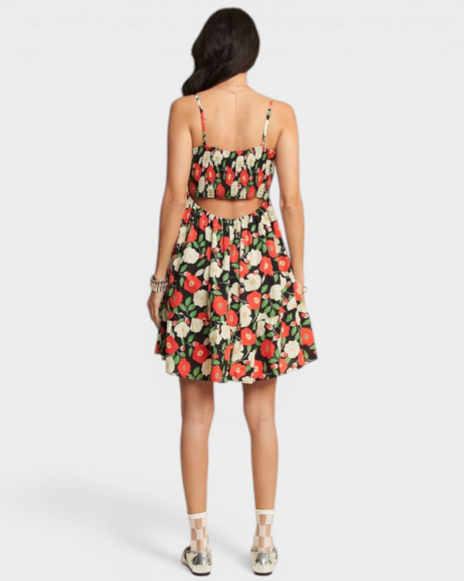 Woman wearing a floral dress on a white background