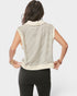 Woman wearing a sleeveless striped top with a white background