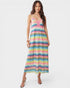 Woman wearing a colorful zigzag patterned dress on a white background