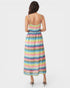 Woman wearing a colorful zigzag patterned dress on a white background