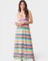Woman wearing a colorful zigzag patterned dress on a white background