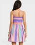 Multicolored dress worn by a person on a white background