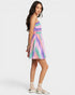 Woman wearing a colorful dress on a white background