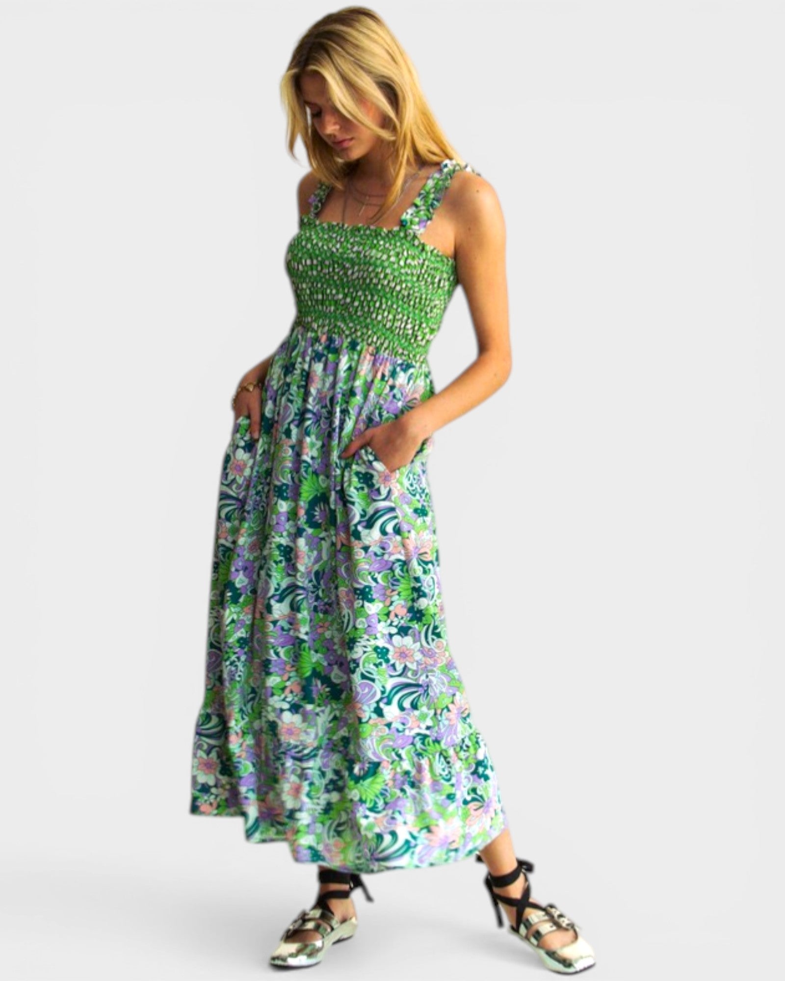 Woman wearing a floral dress on a white background