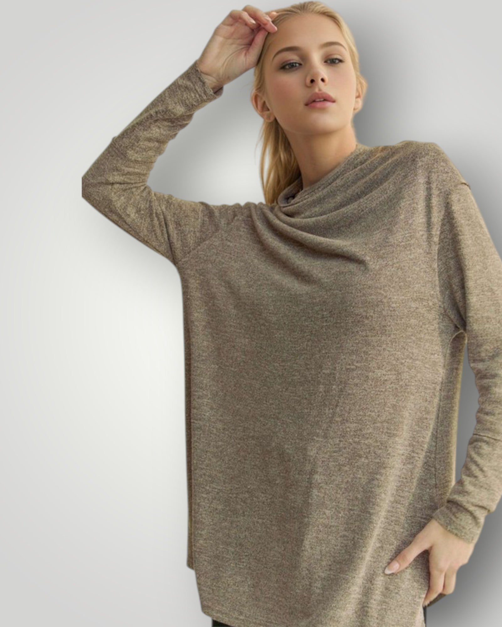 Woman wearing a beige long-sleeve dress against a plain background