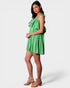Woman wearing a green checkered dress on a white background