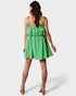 Green checkered dress with ruffles on a white background