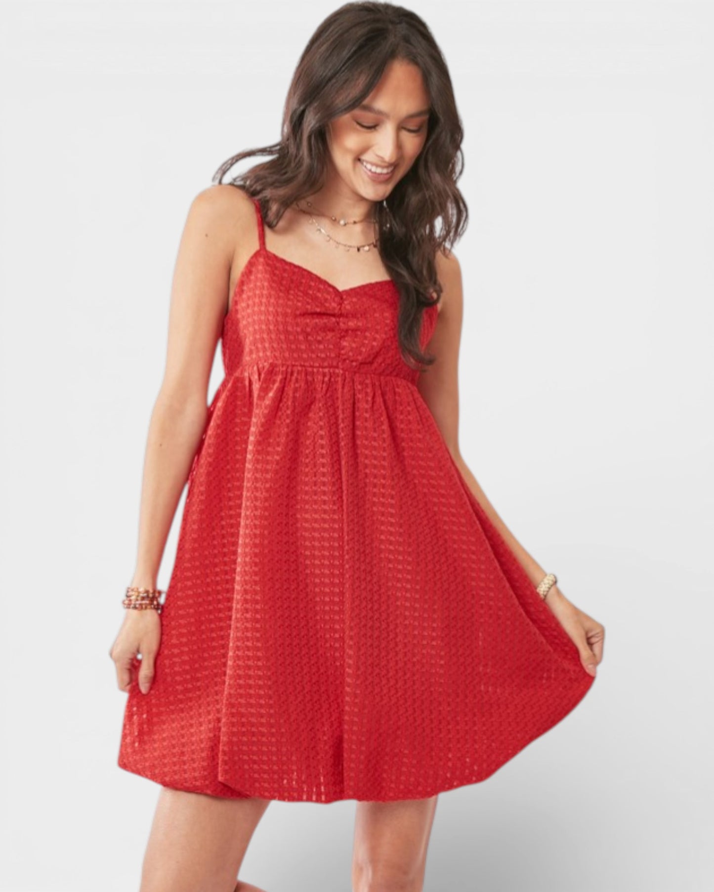 Woman wearing a red dress on a white background