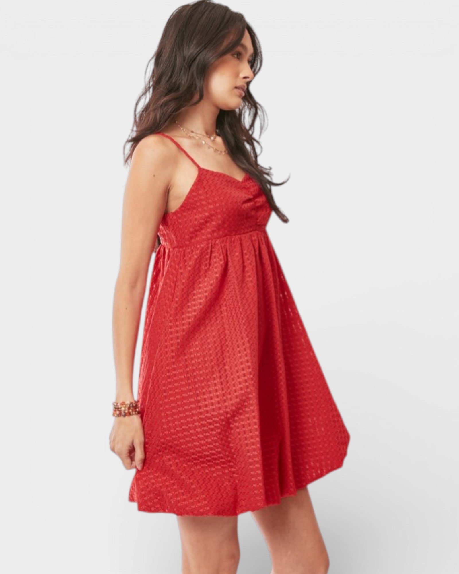 Woman wearing a red dress on a white background