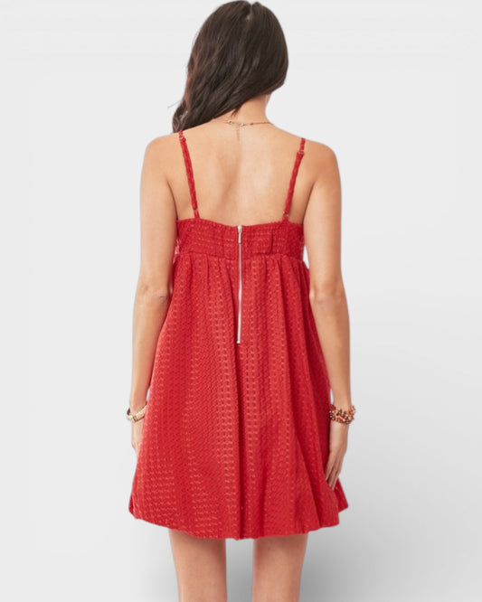 Red dress worn by a person on a white background