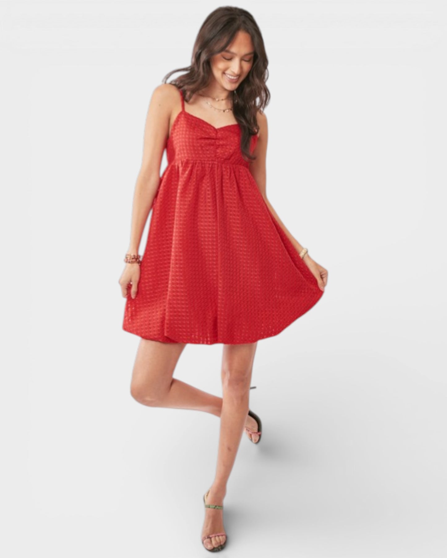 Woman wearing a red dress on a white background