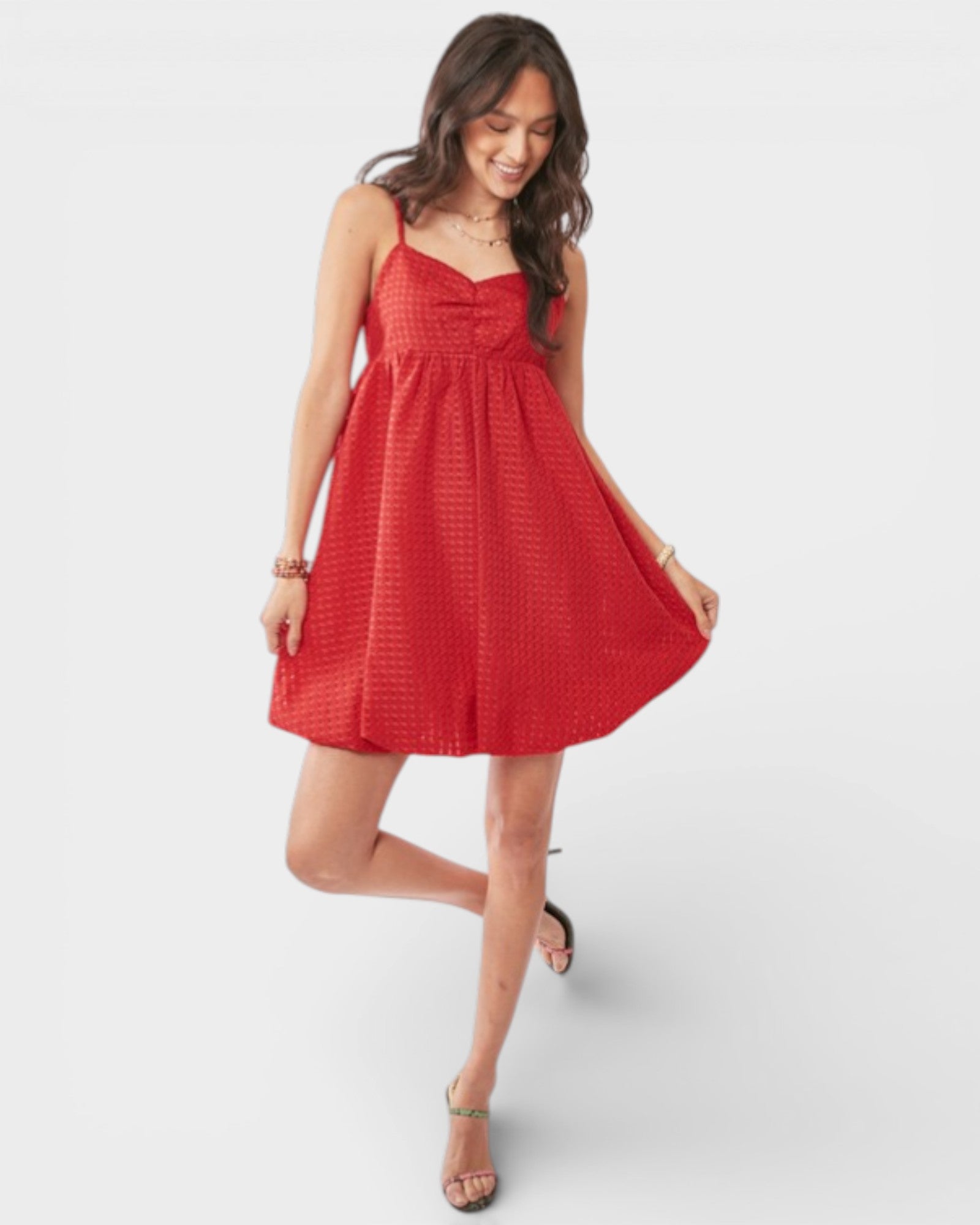 Woman wearing a red dress on a white background