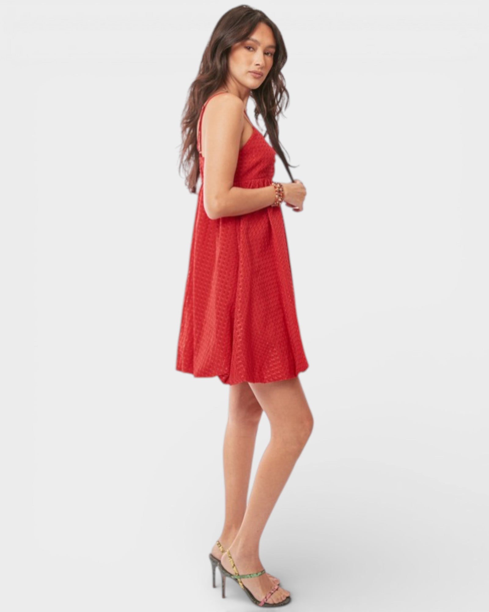 Woman wearing a red dress on a white background