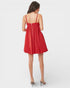 Woman wearing a red dress on a white background