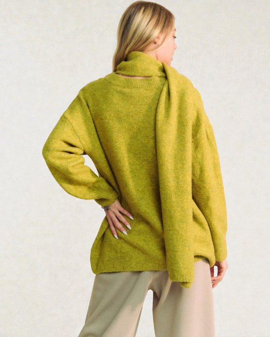 Woman wearing a green sweater against a white background