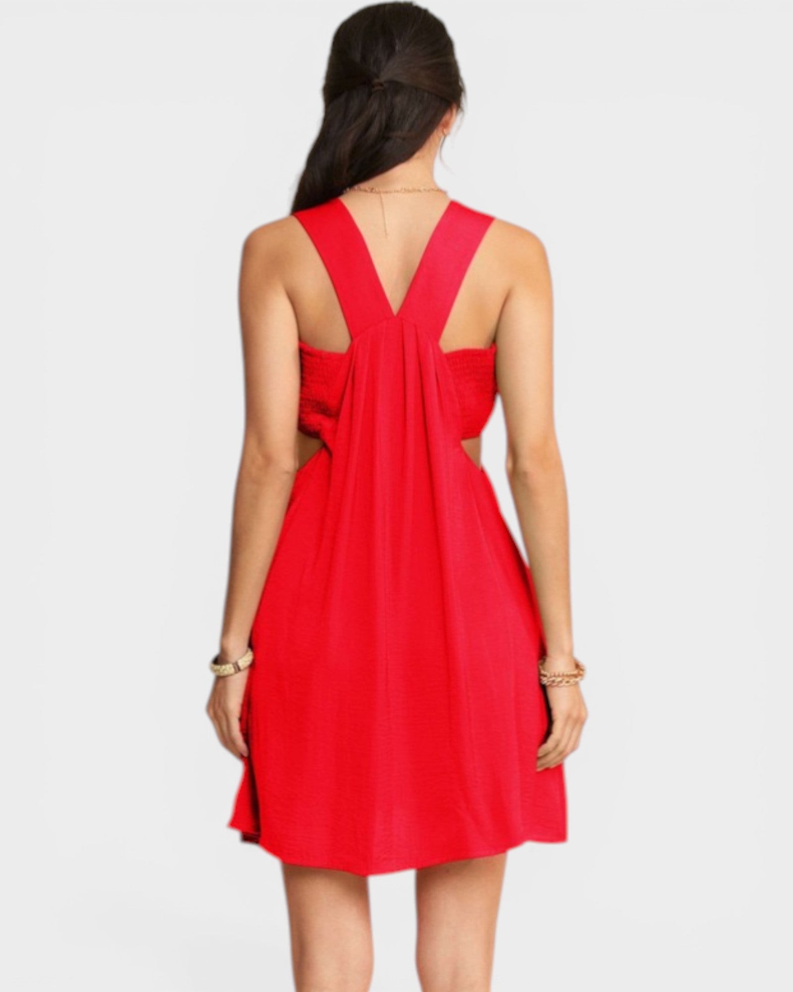 Red dress with cut-out design on a white background