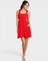 Woman wearing a red dress on a white background