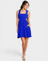 Woman wearing a blue dress on a white background