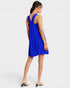 Woman wearing a blue dress with a white background