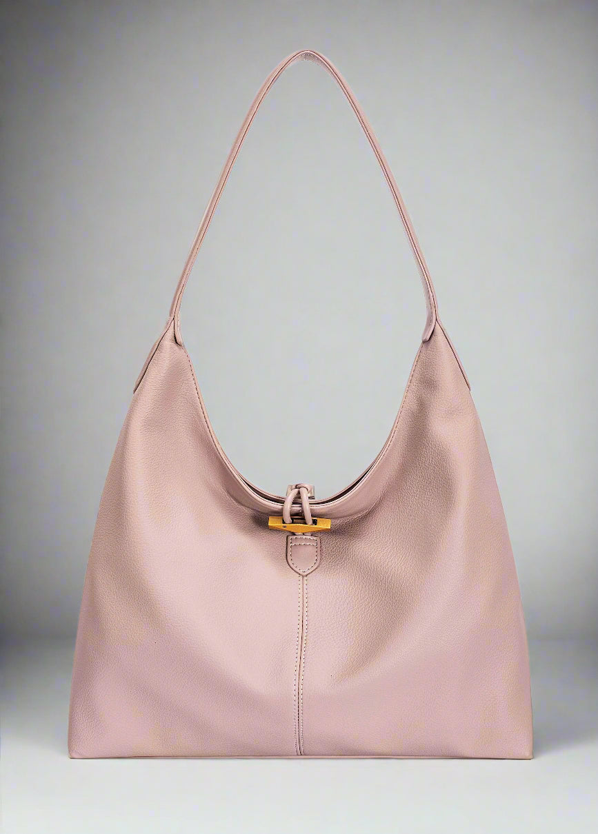 Pink handbag with a gold clasp on a white background