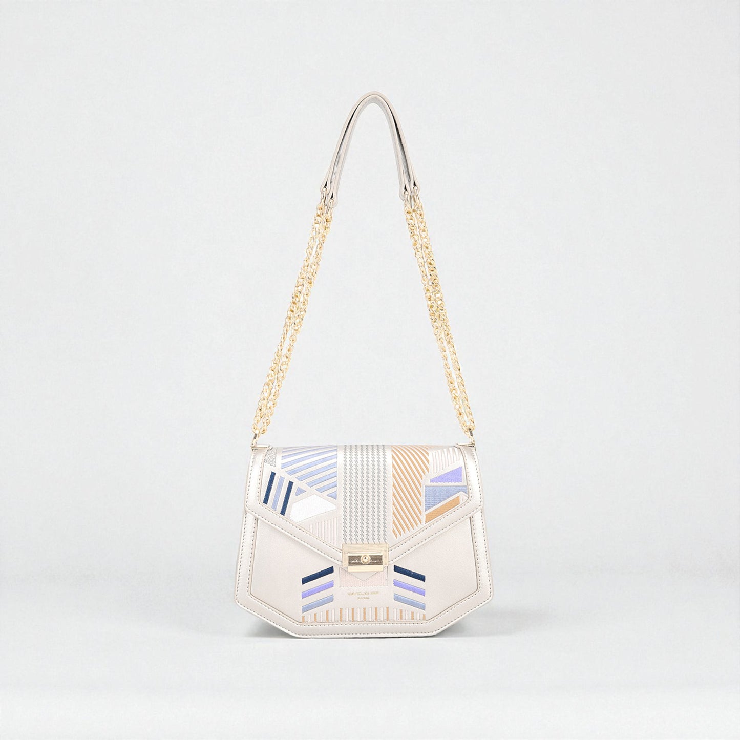 Handbag with geometric pattern on a light gray background