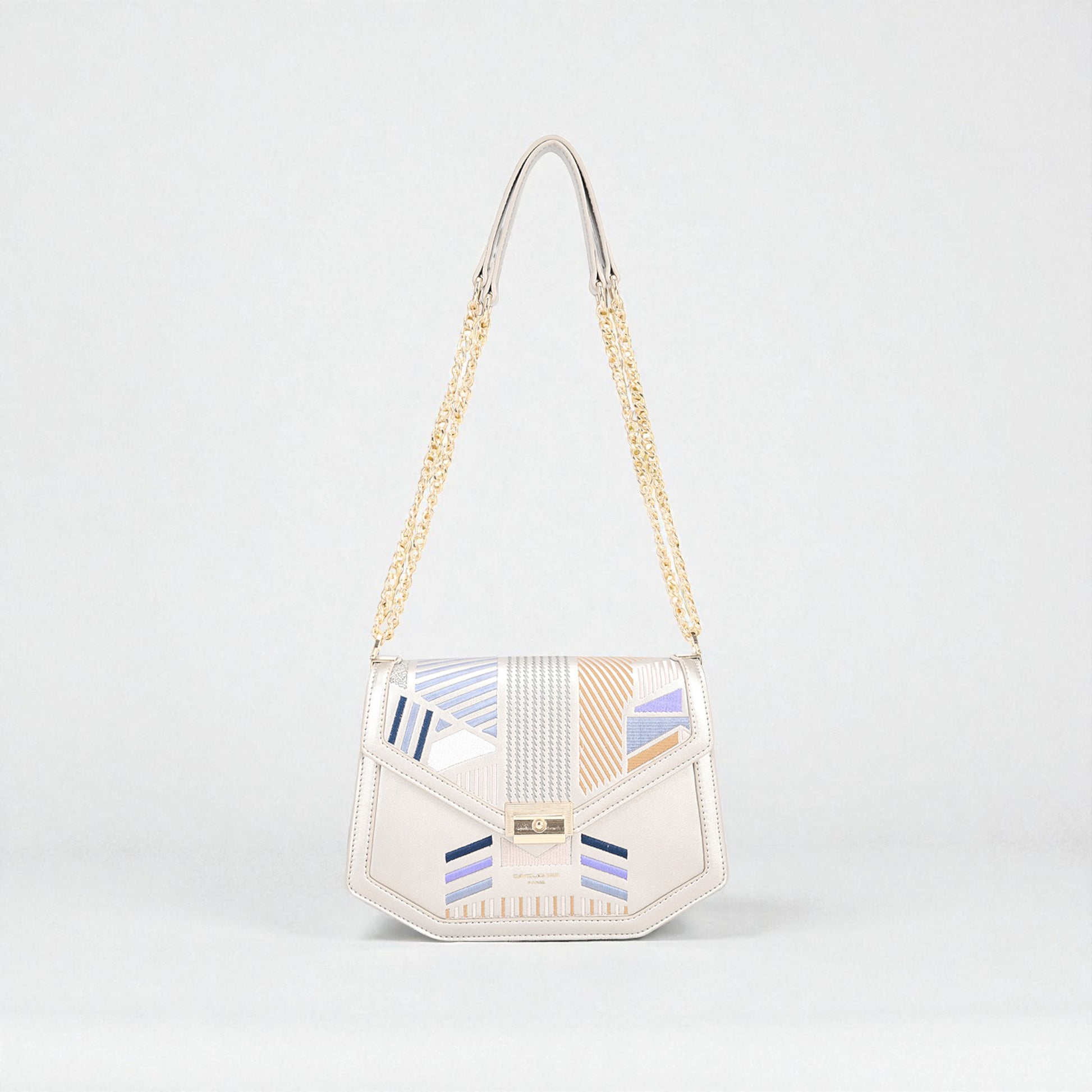 Handbag with geometric pattern on a light gray background