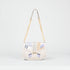Handbag with geometric pattern on a light gray background