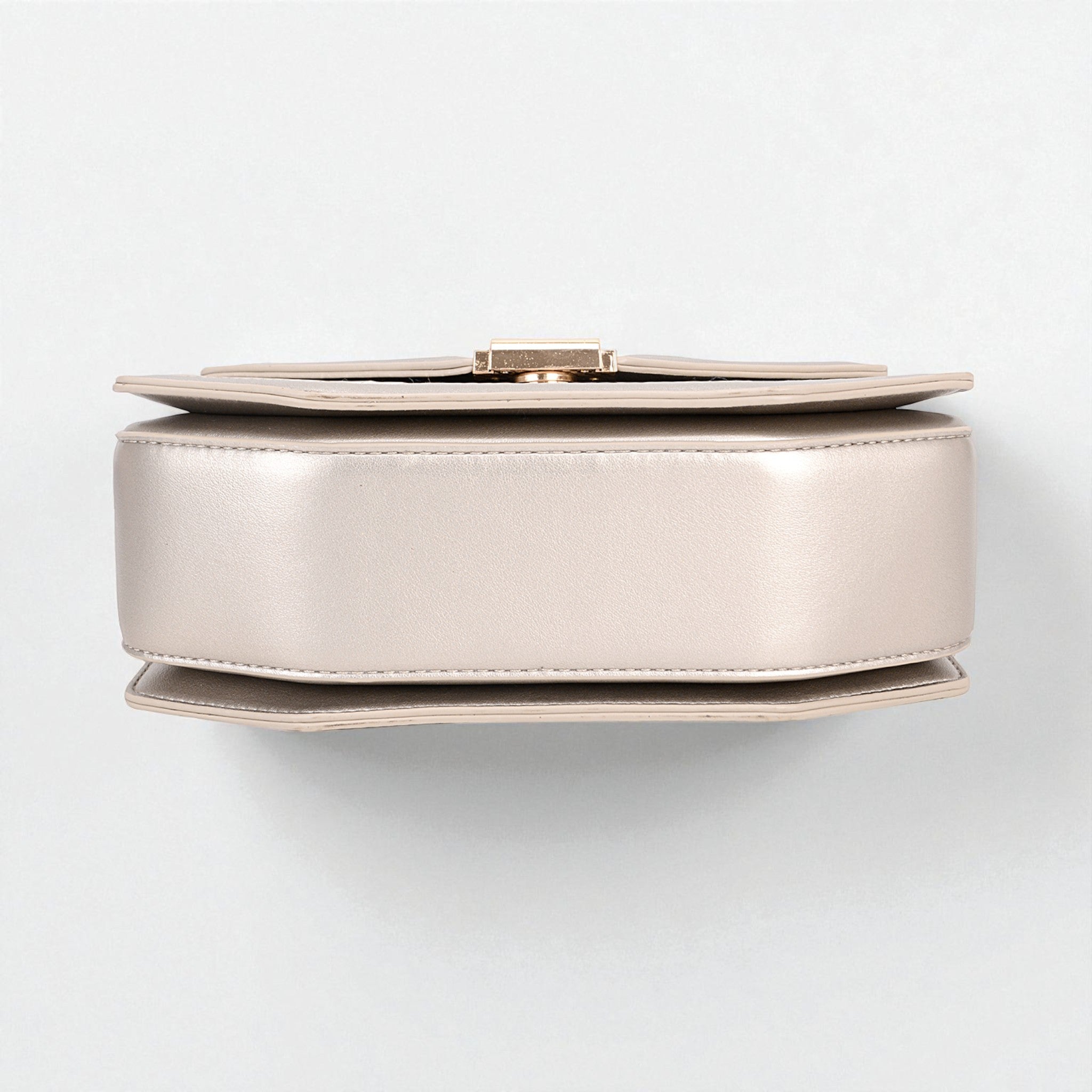 Round metallic object on a white background