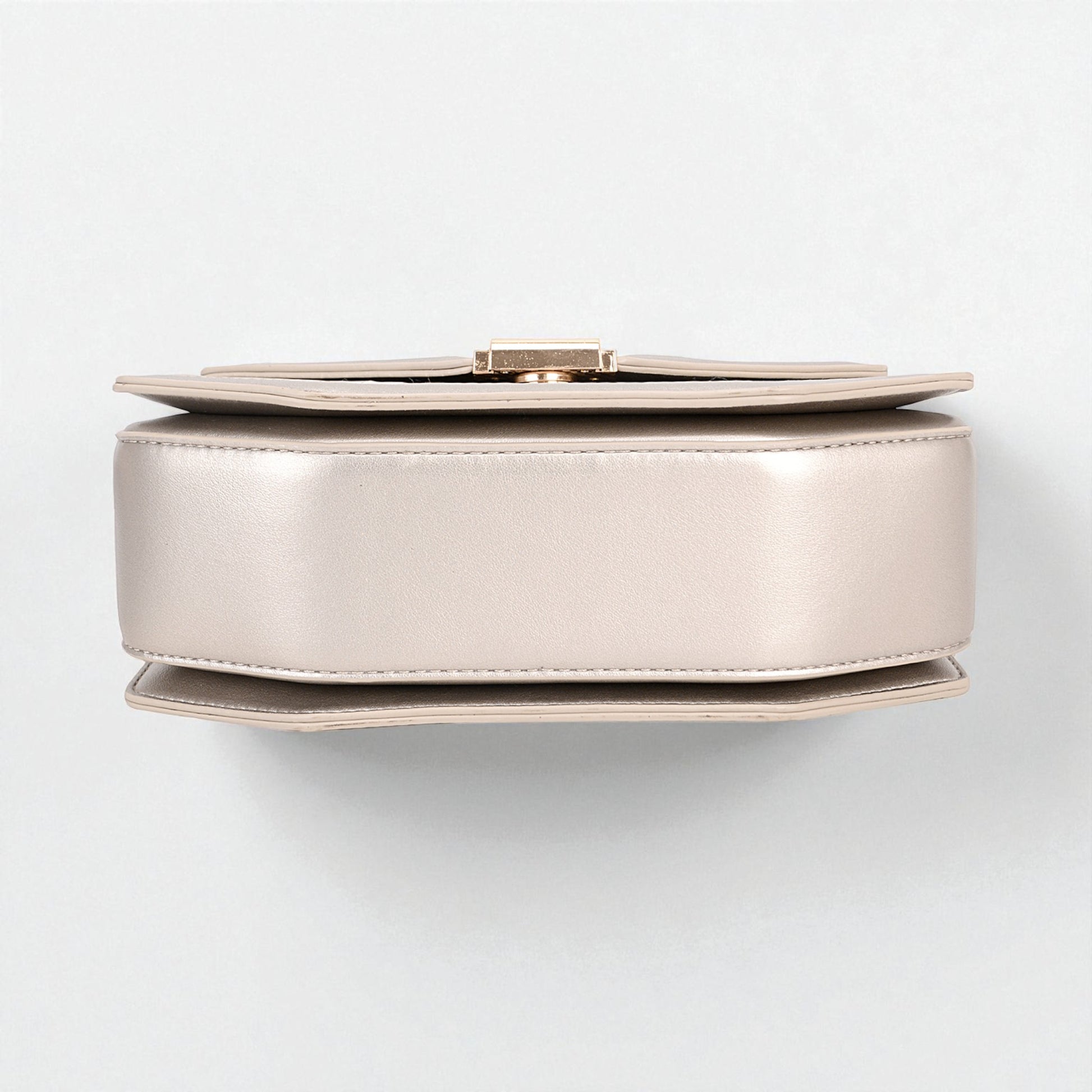 Round metallic object on a white background