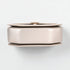Round metallic object on a white background