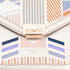Colorful handbag with geometric patterns and 'David Jones' branding.