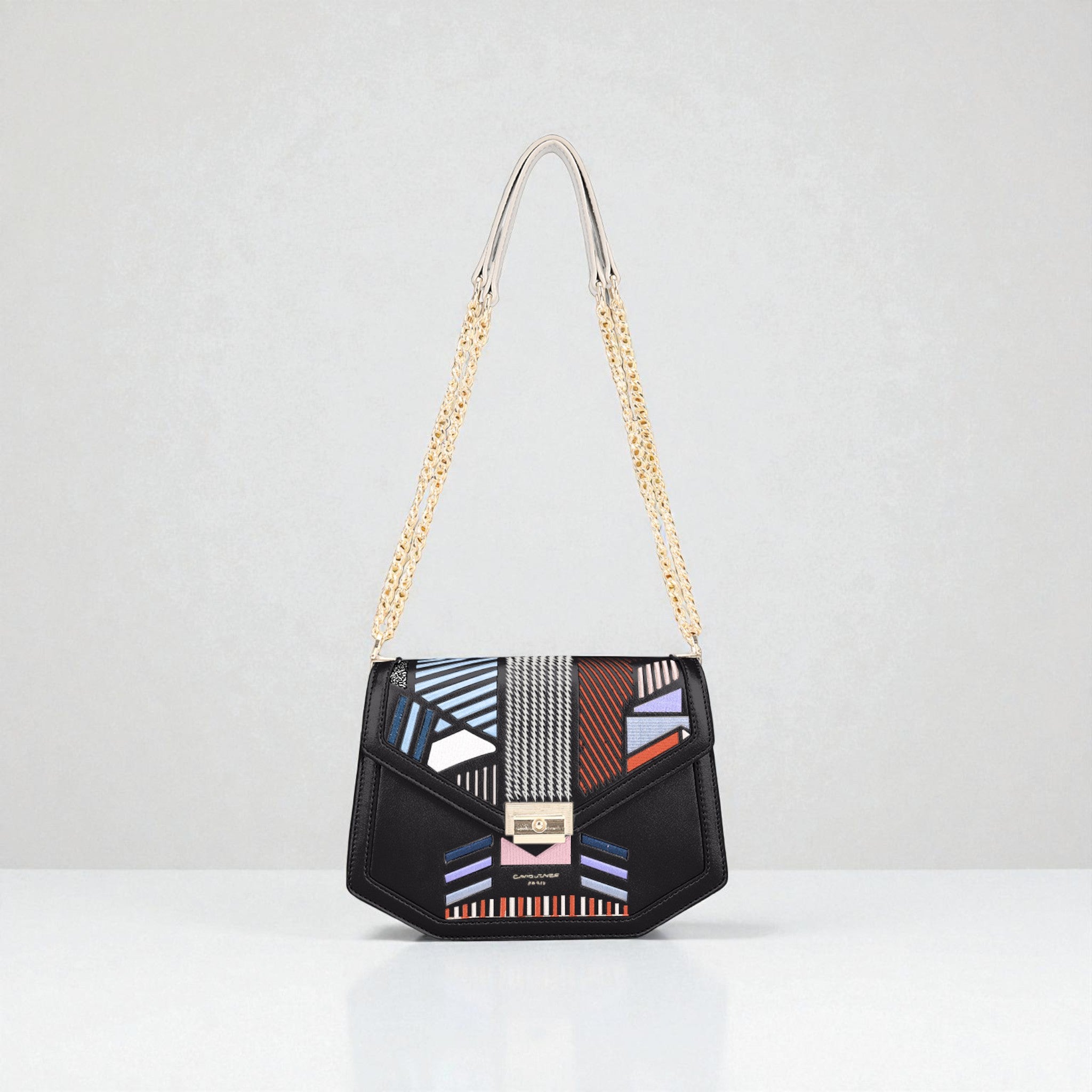 Black handbag with geometric pattern and gold chain strap on a white background
