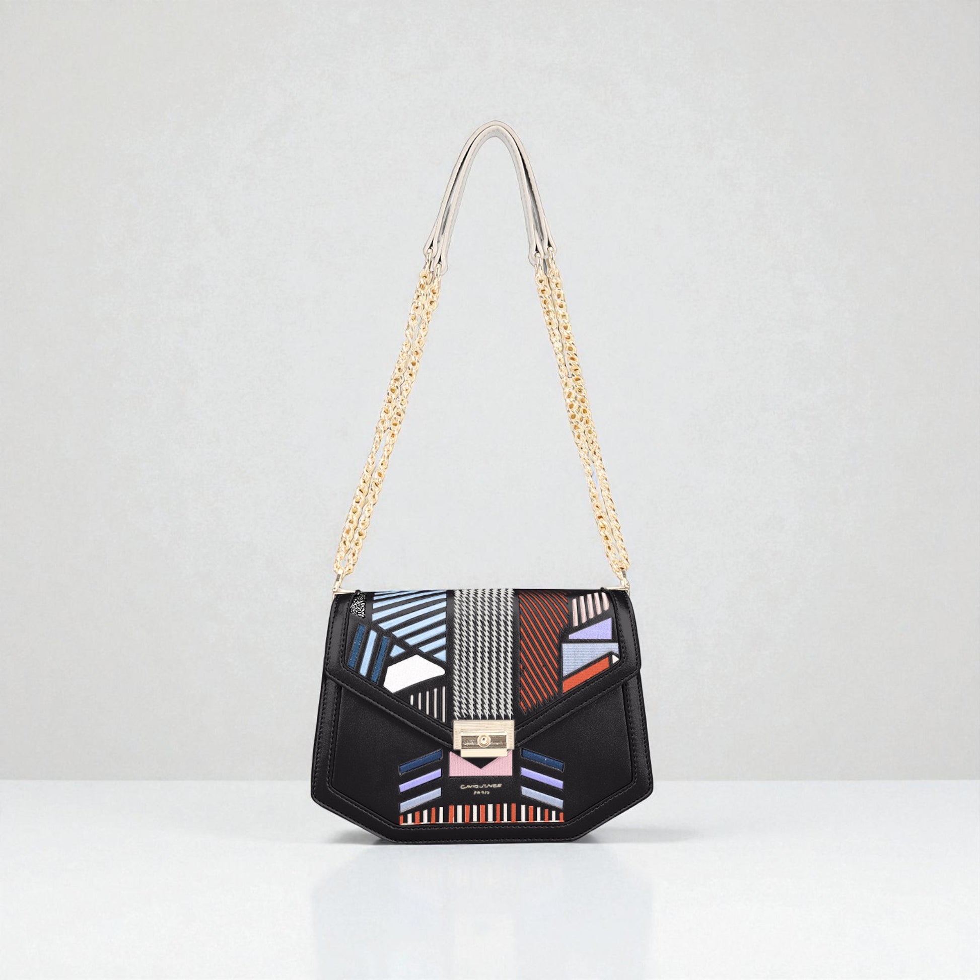 Black handbag with geometric pattern and gold chain strap on a white background