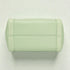 Light green quilted handbag on a light gray background