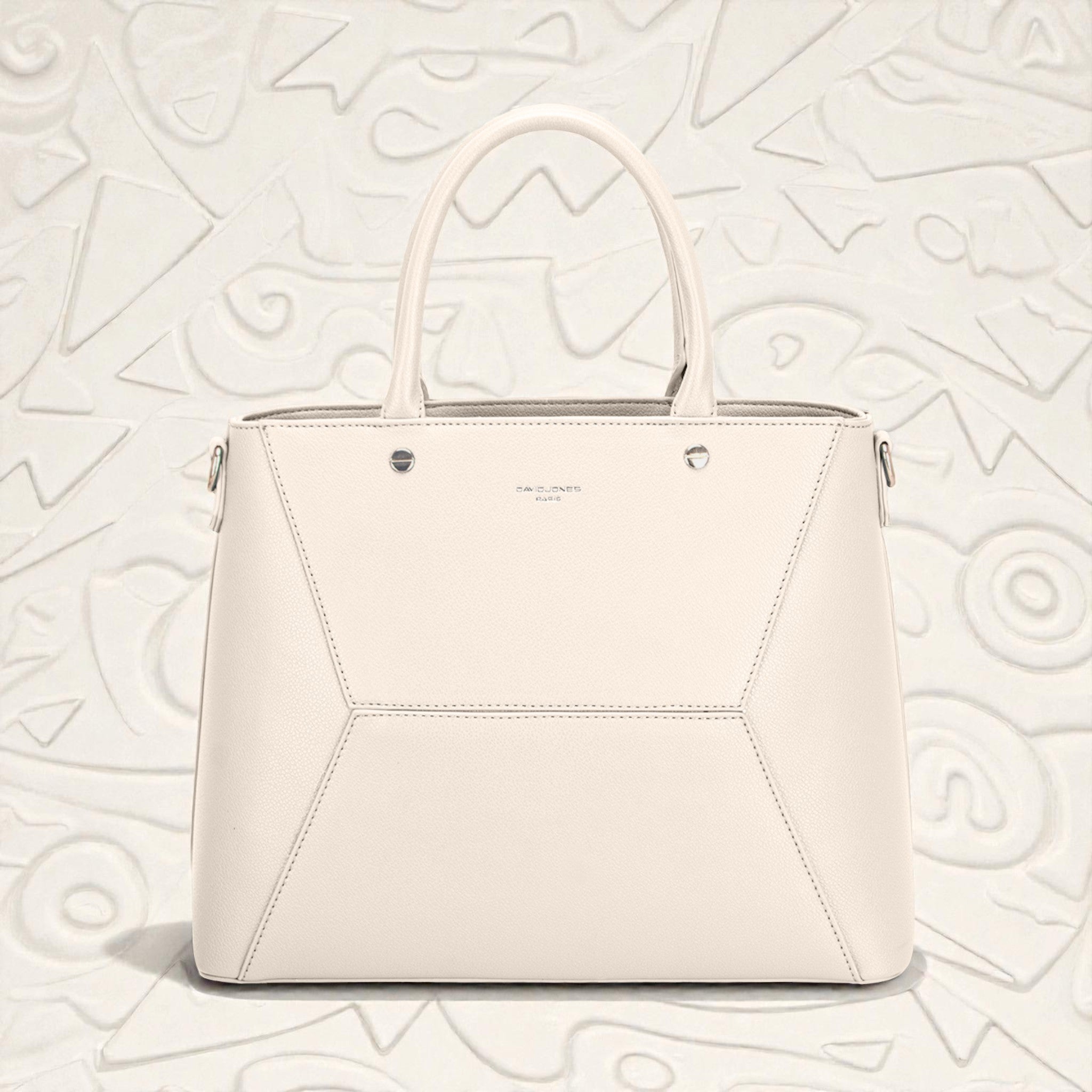 White handbag on a light gray textured background