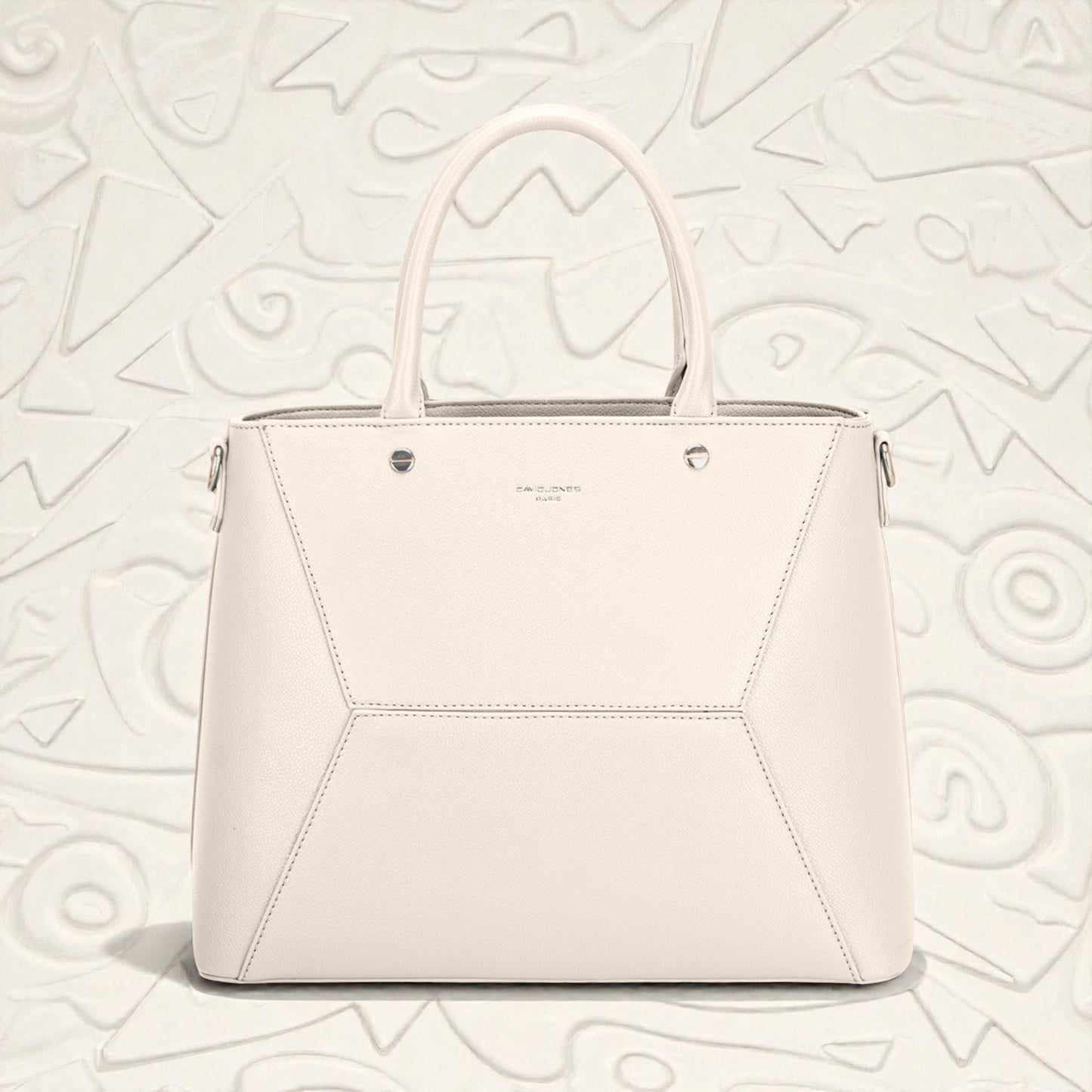White handbag on a light gray textured background