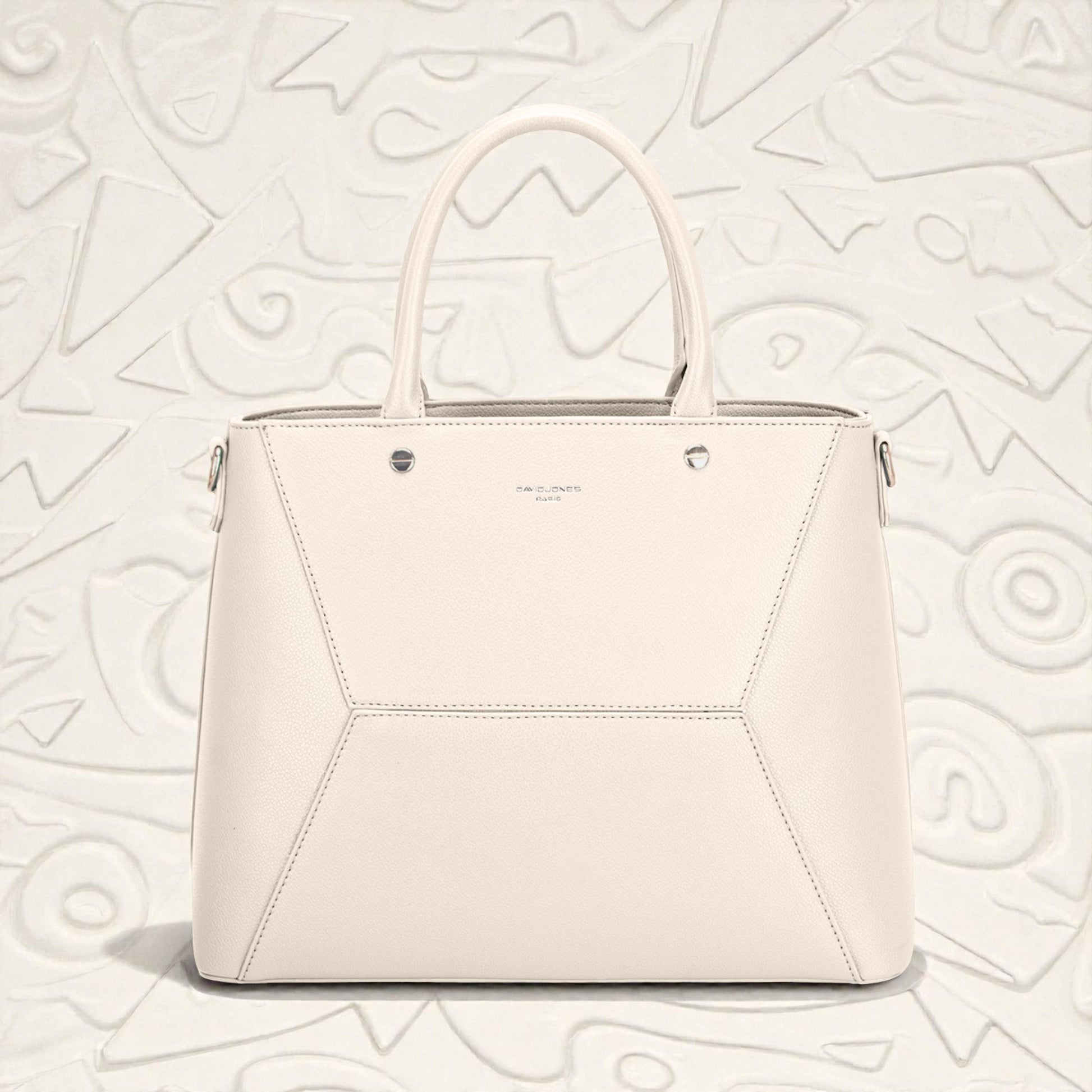 White handbag on a light gray textured background