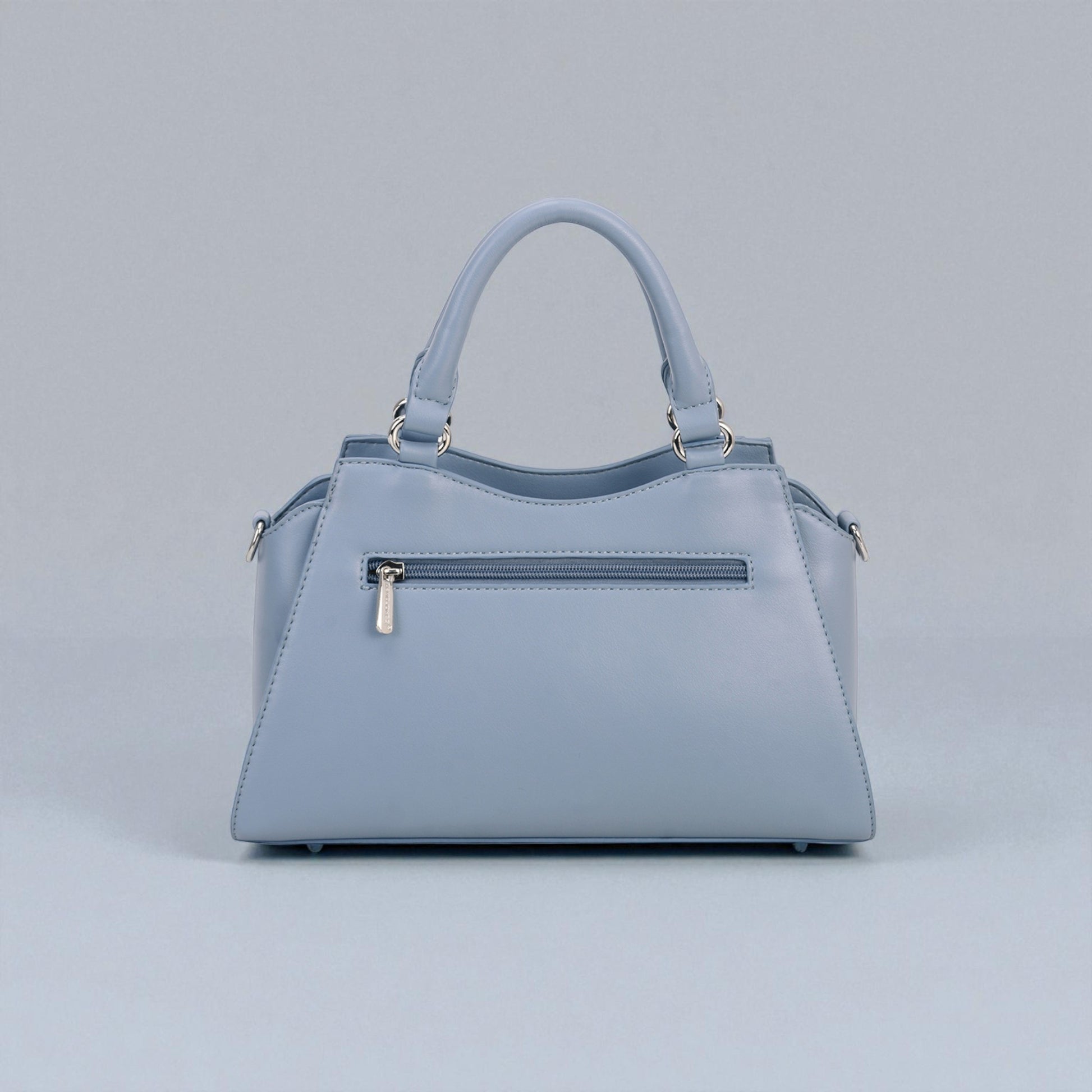 Light blue handbag on a gray background