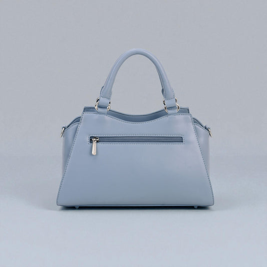 Light blue handbag on a gray background