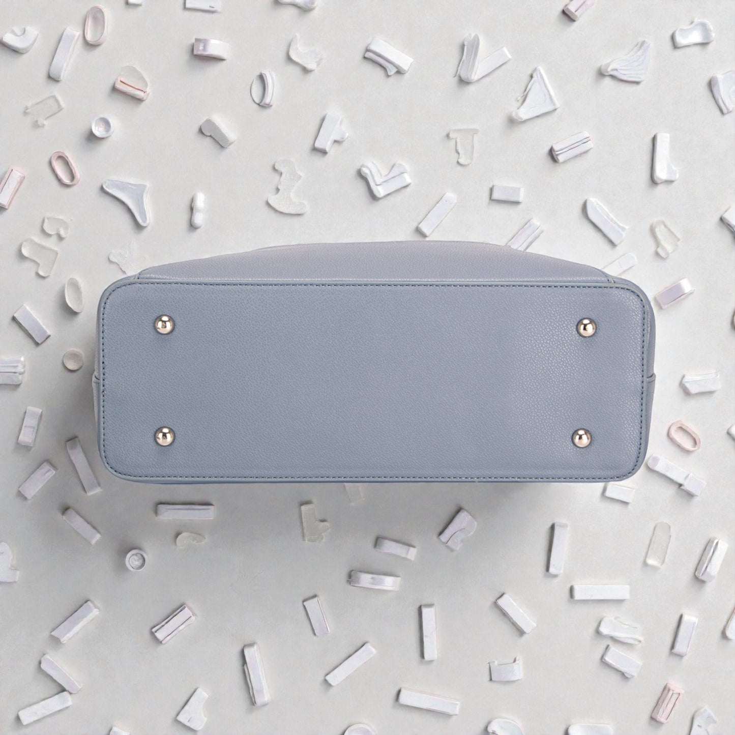 Light blue wallet on a light gray background with decorative elements