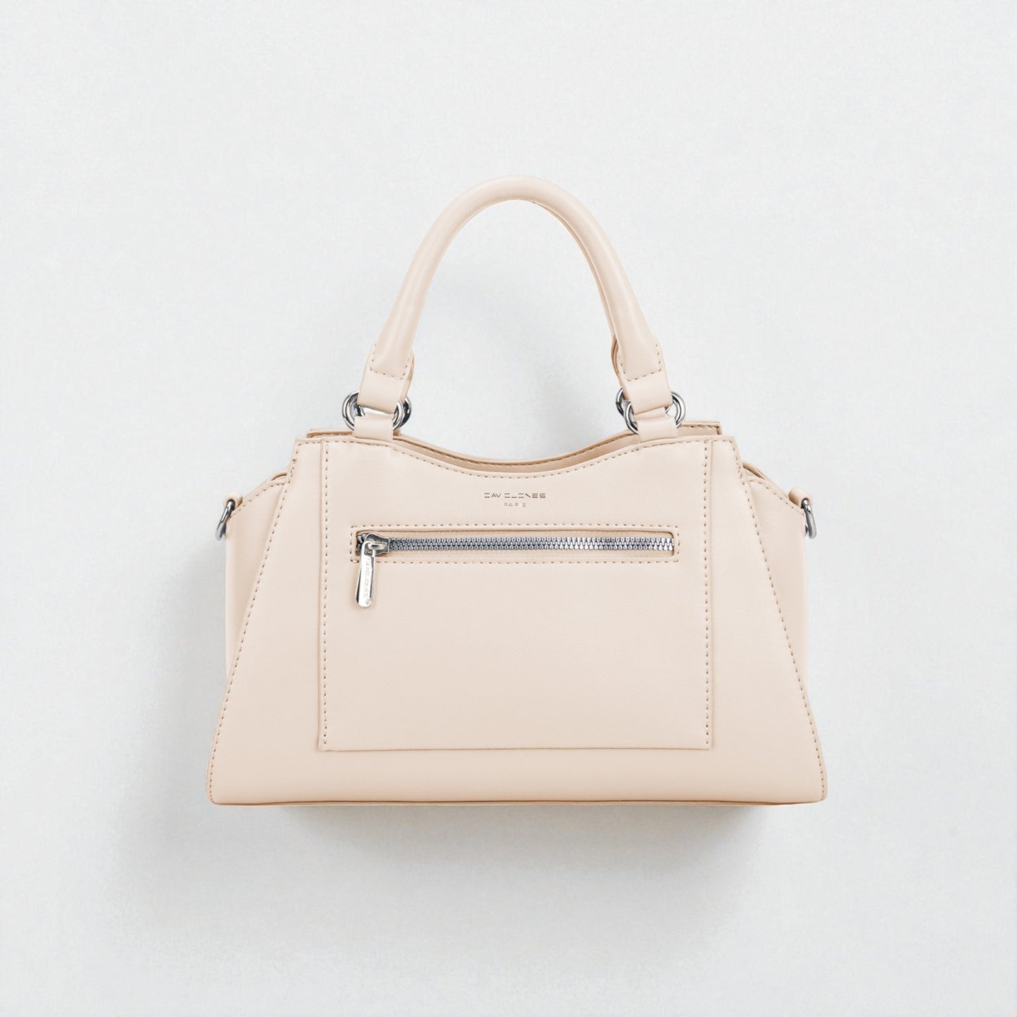 Beige handbag with silver zippers on a light gray background
