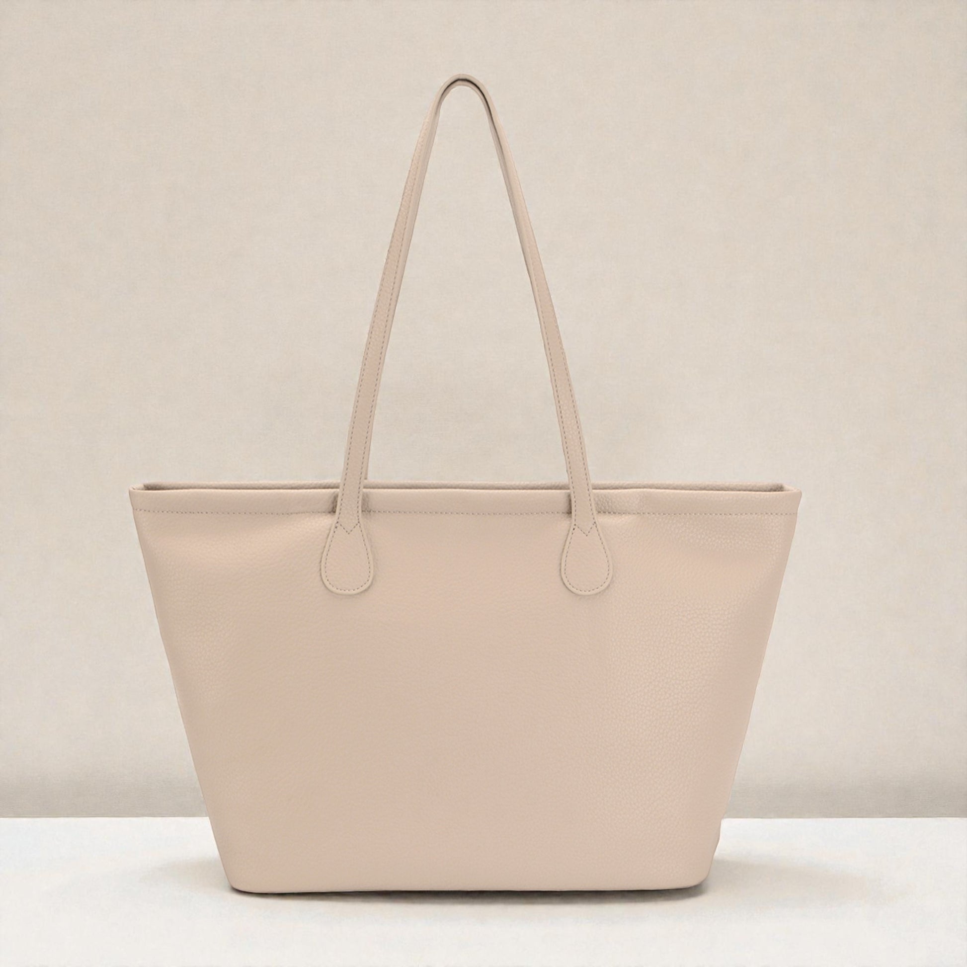 Beige tote bag on a light beige background