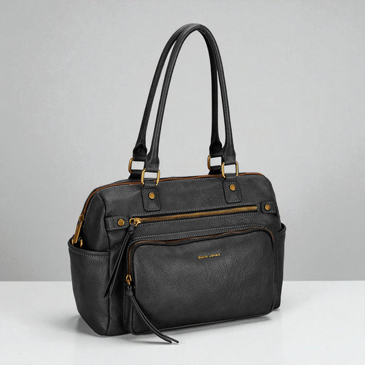 Black handbag with gold accents on a gray background