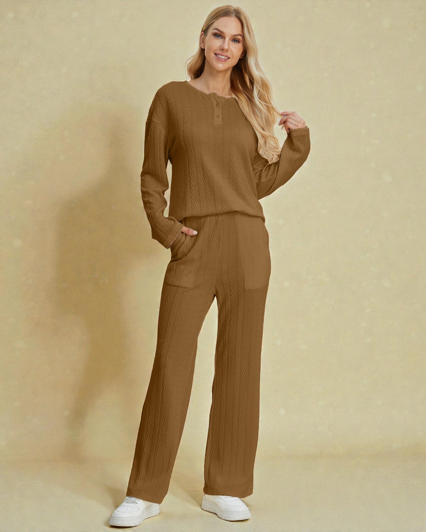 Woman wearing a brown outfit against a beige background