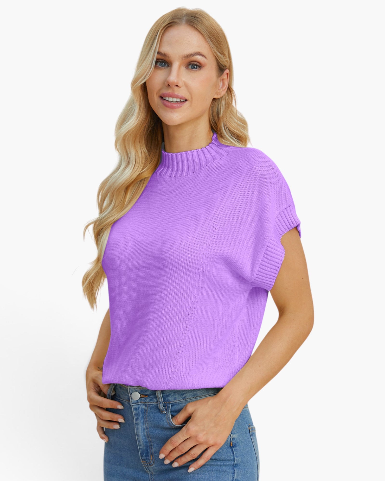 A woman modeling a short-sleeve knit sweater in light purple with ribbed trim at the mock neck and sleeve cuffs, paired with blue jeans against a plain white background.