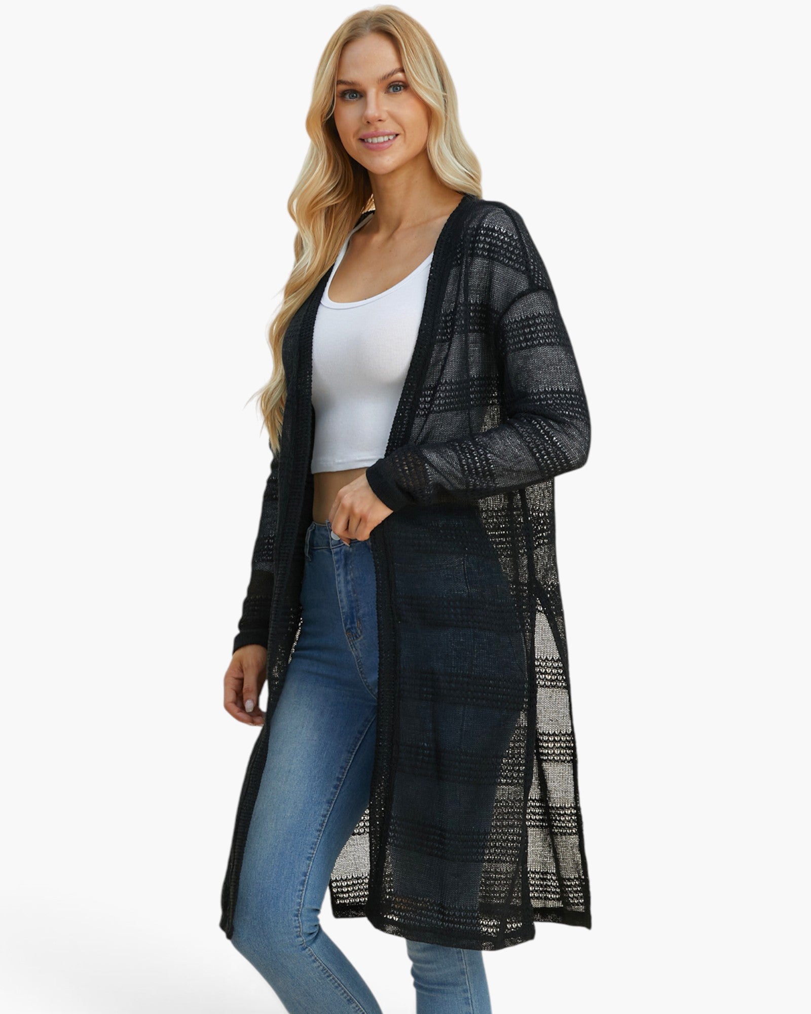 A woman modeling a long black open-front cardigan with a subtle plaid pattern over a white tank top and blue jeans, set against a plain white studio background.