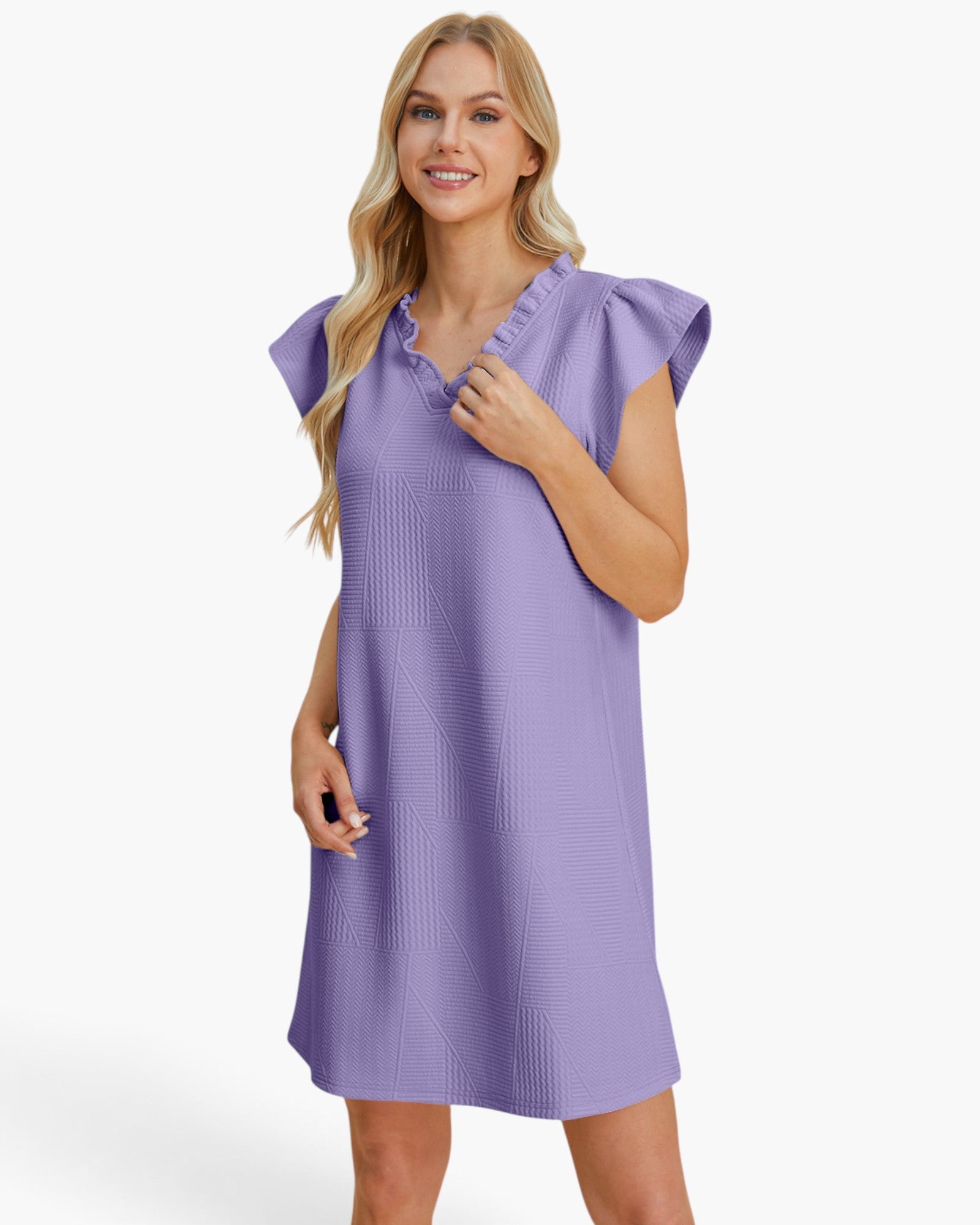 A woman modeling a lavender-purple textured dress with ruffled cap sleeves and a split neckline, photographed against a clean white studio background.