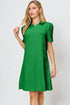 Woman wearing a green dress against a white background