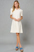 Woman wearing a white dress on a gray background